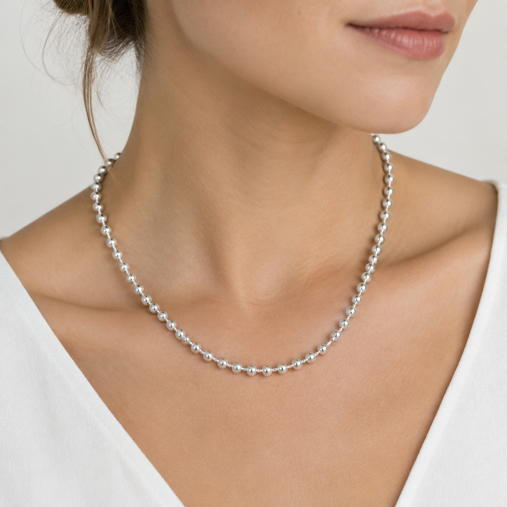 Woman wearing sterling silver chain necklace
